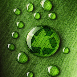Water drops on leaf and recycle logo